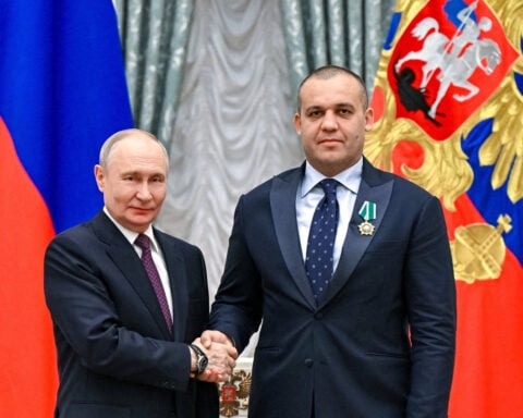 Olympics-Putin criticises previous IOC leadership as 'shameful, cowardly'