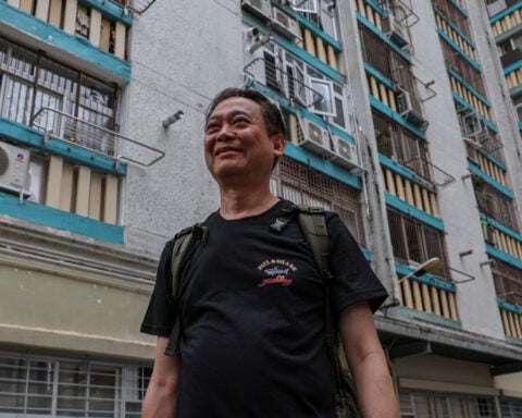 Hong Kong fire victim returns to search for memories of his dog