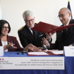 UK and French governments sign a 3-year deal to curb migrant crossings in English Channel