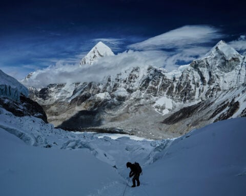 A massive, unstable ice block stalls Everest climbers at base camp