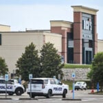 Authorities arrest one person and search for another, following deadly shooting at mall in Louisiana