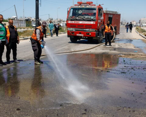 Israeli fire kills 12 in Gaza, medics say