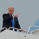 Republicans retool midterm strategy: Trump's policies, but less Trump