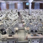 AI robots are learning to do simple human tasks at a factory in Massachusetts
