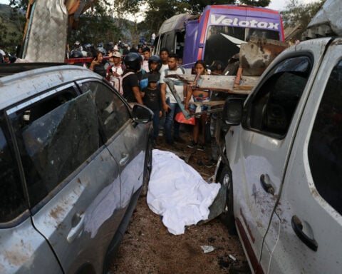 An explosive device kills 13 and injures 38 on a bus in southwestern Colombia as violence persists