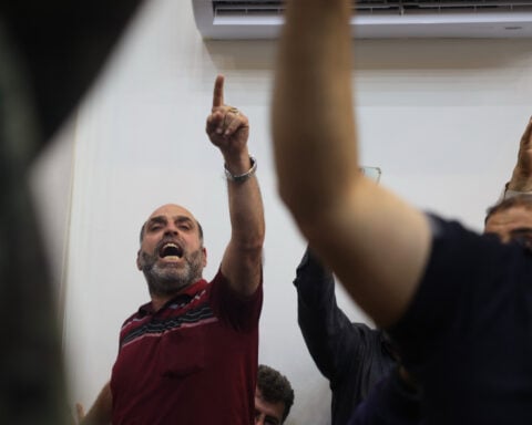 Syria’s first public trial of Assad-era officials opens in Damascus