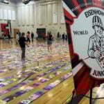 Eisenhower Junior High students attempt world record for longest line of coloring pages