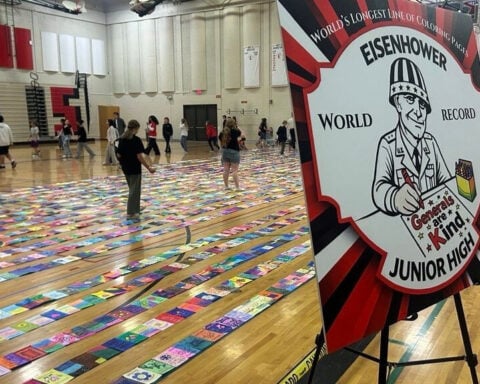 Eisenhower Junior High students attempt world record for longest line of coloring pages