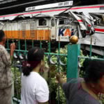 Indonesia commuter train crash toll rises to 14 as rescuers complete evacuation