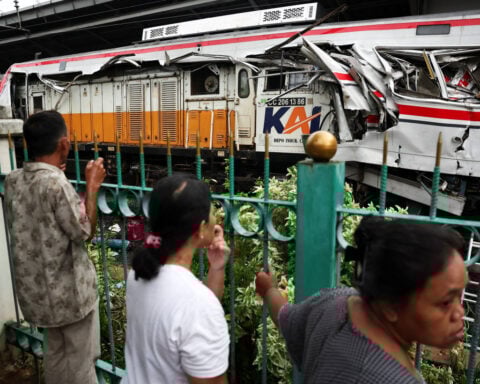 Indonesia commuter train crash toll rises to 14 as rescuers complete evacuation