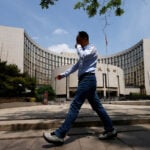 China's central bank guides banks to step up lending in April, sources say