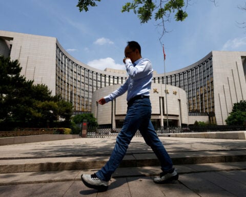 China's central bank guides banks to step up lending in April, sources say