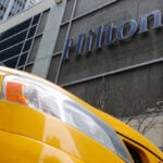 Hilton raises annual room revenue growth forecast on strong travel demand