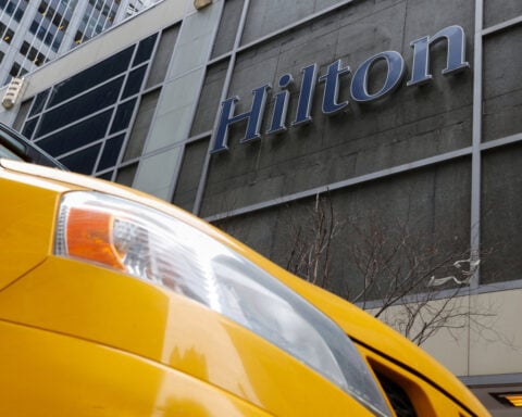 Hilton raises annual room revenue growth forecast on strong travel demand