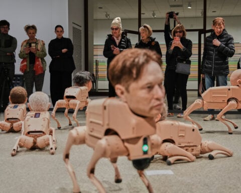 Robot dogs with Musk and Zuckerberg heads roam around Berlin gallery in Beeple's new exhibit
