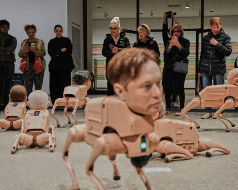 Robot dogs with Musk and Zuckerberg heads roam around Berlin museum in Beeple's new exhibit