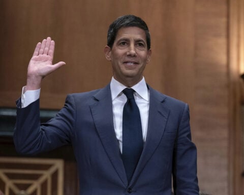 Fed likely to leave rates unchanged at what may be Powell's last meeting, as Warsh to advance