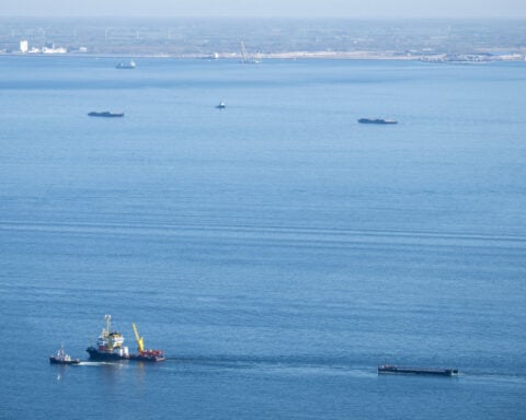 A barge carrying Timmy the humpback whale journeys to the North Sea