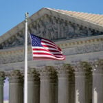 The Latest: Supreme Court to hear arguments on ending legal protections for Haitian/Syrian migrants