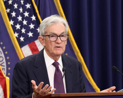 Fed's Powell says he will stay on as governor after chair term ends