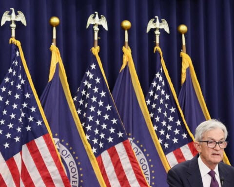 Powell says decision to stay on at Fed for a time reflects his concern over legal attacks