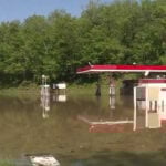 Kansas City man accused of high-speed chase in stolen SUV, fleeing into floodwater