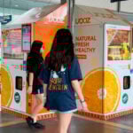 French teen charged in Singapore over a vending machine straw-licking video