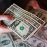 Dollar hits multi-week highs as oil surges, yen near 160