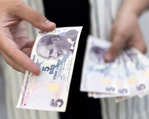 EM stocks, FX fall on renewed Iran war risks, but set for monthly gains