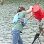 Oysters raised by students added to oyster reef