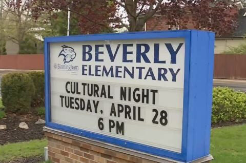 Stickers showing assault rifles and political slurs found at Beverly Elementary School event