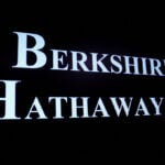 Berkshire Hathaway operating profit rises, cash sets record