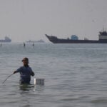U.S.-led task force tells ships to reroute on first day of new effort to reopen the Strait of Hormuz