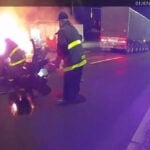 VIDEO: Firefighter pulls woman from burning SUV, family calls him a hero
