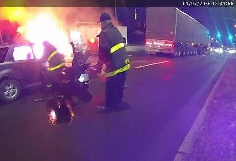 VIDEO: Firefighter pulls woman from burning SUV, family calls him a hero