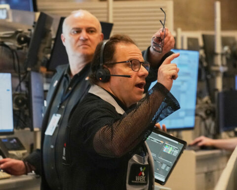 Wall Street falls from its records and oil prices jump after fighting flares in the Middle East