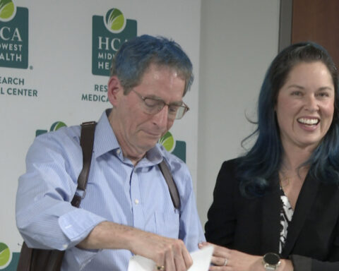 Man hit by garbage truck while riding bike reunites with doctors who saved his life