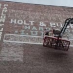 Faded "ghost signs" of Boston's past now being restored on West End buildings