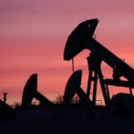 US crude eases more than 1%, traders weigh supply risks
