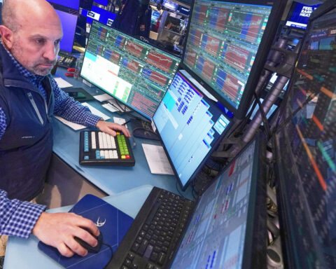 Wall Street rallies to records after oil prices ease and corporate profits keep topping expectations
