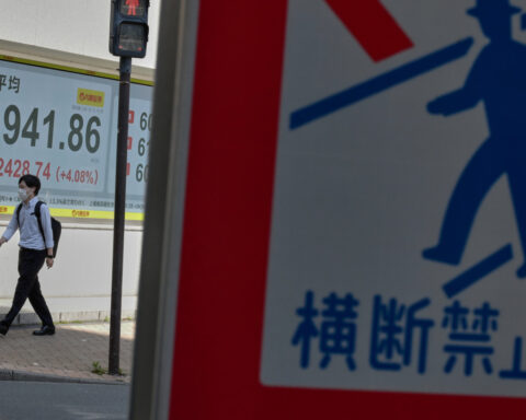 Hopes for reopening the Strait of Hormuz push Asian shares higher, as oil prices hold above $100
