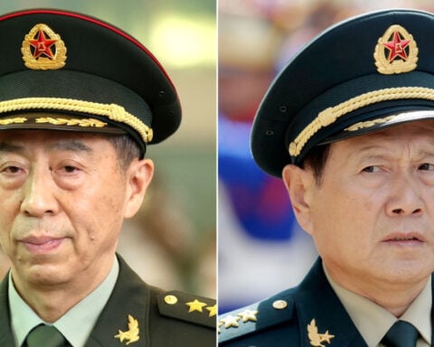 China gives suspended death sentences to two former defense ministers