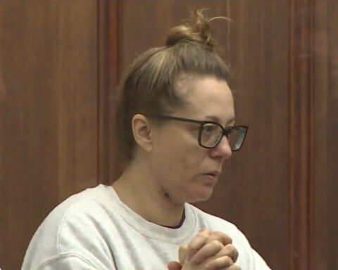 Tearful Mother charged with killing her 2 children in Massachusetts court arraignment