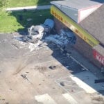 Driver killed after crashing truck into building