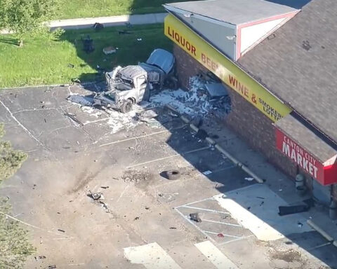 Driver killed after crashing truck into building