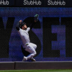 Yankees' Jasson Domínguez leaves game after crashing into left-field wall catching leadoff drive