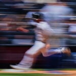Grisham leads Yankees over Rangers 9-2 for 16th win in 19 games but Domínguez hurt hitting wall