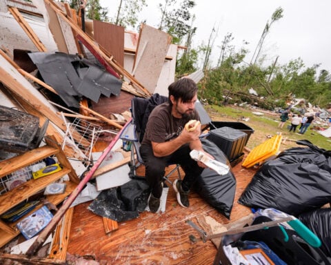 Survivors of Mississippi tornadoes crawled under furniture and held onto their kids