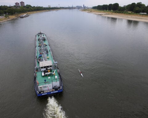 Water levels on river Rhine in Germany rising after rain but vessels still part loaded