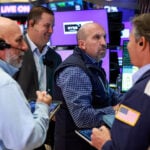 Wall St opens higher after jobs data, chip rebound